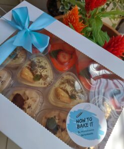 Mini strawberry cheesecake, oreo dessert and peppermint crisp dessert cups packed in a box ready for gifting