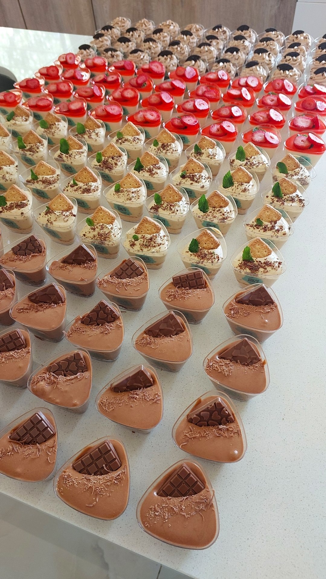 2025/04/1001221434.jpg Beautiful, delicious and colourful mini dessert cups displayed for any event